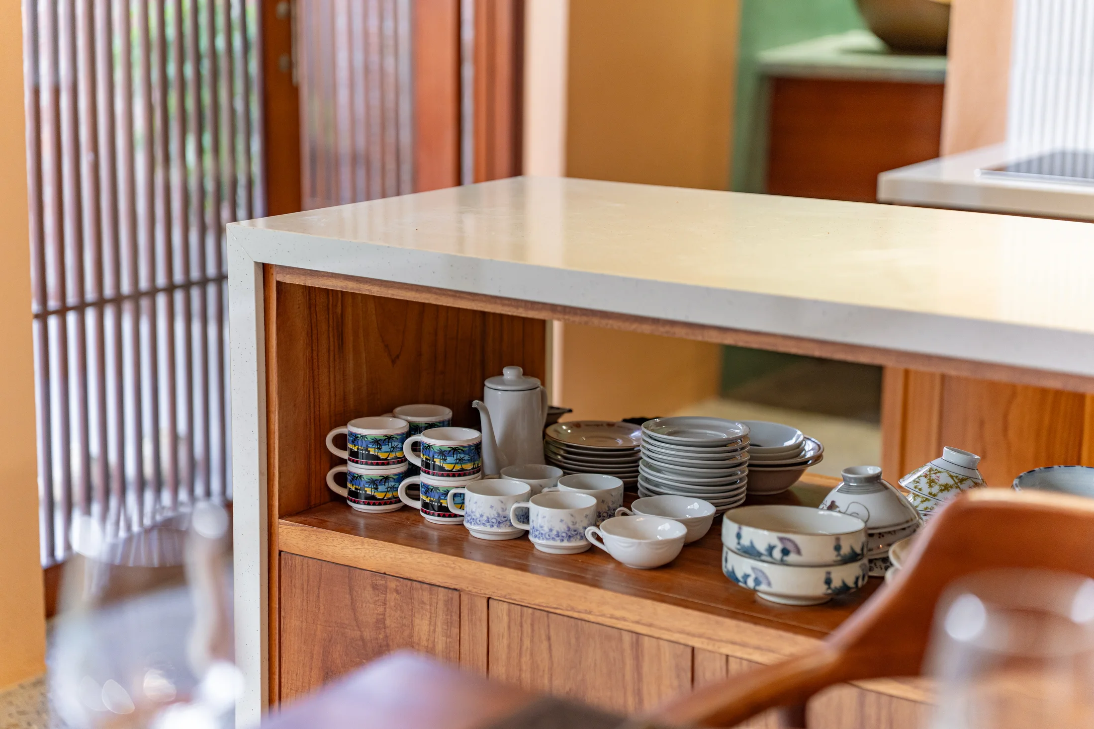 Modern kitchen island with ceramics and glassware